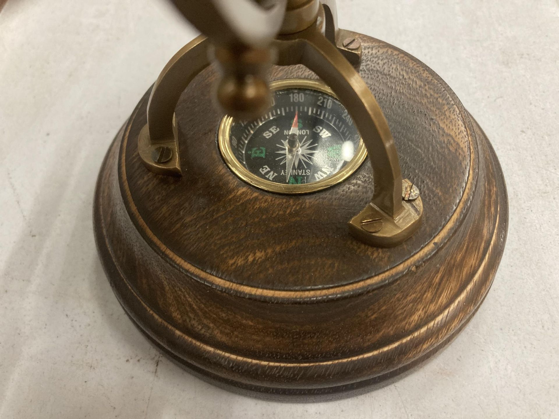 A WORLD GLOBE WITH A COMPASS ON A WOODEN BASE HEIGHT APPROX 24CM - Image 3 of 3