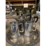 A SILVER PLATED TRAY WITH TWO TANKARDS, A TEAPOT AND TWO COFFEE POTS