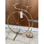 A MINIATURE METAL PENNY FARTHING