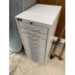 A MINIATURE EIGHT DRAWER TRIUMPH FILING CABINET