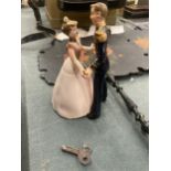 A CLOCKWORK PRINCE AND PRINCESS TOY 13CM