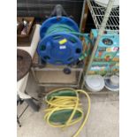 TWO GARDEN HOSE REELS