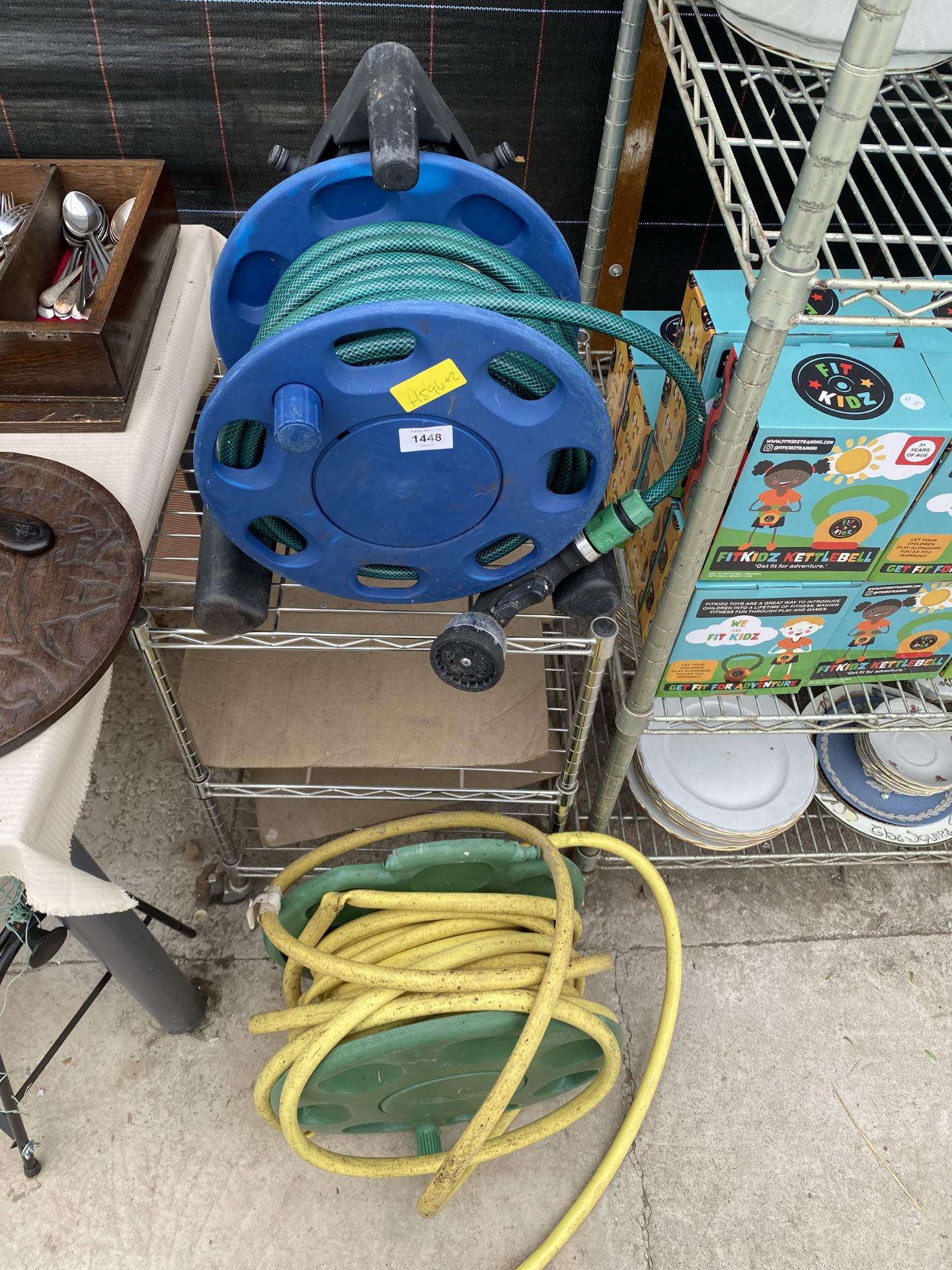 TWO GARDEN HOSE REELS