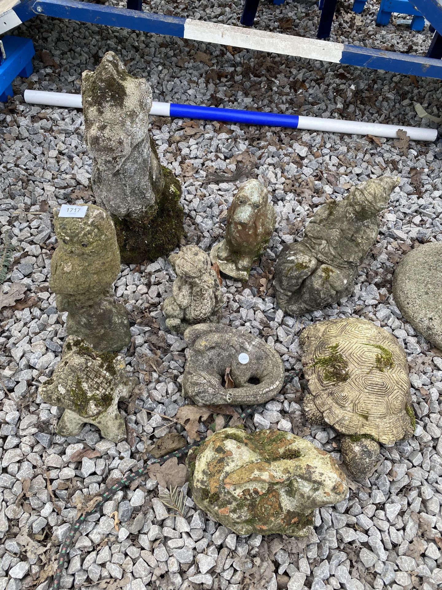 AN ASSORTMENT OF RECONSITUTED STONE GARDEN FIGURES TO INCLUDE A TURTLE, AN OWL AND A DOG ETC