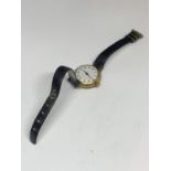 A VINTAGE SWISS 9CT YELLOW GOLD CASED LADIES TRENCH STYLE WATCH