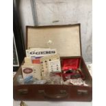 A VINTAGE SUITCASE CONTAINING A QUANTITY OF GEMSTONES AND GEMSTONE BOOKS