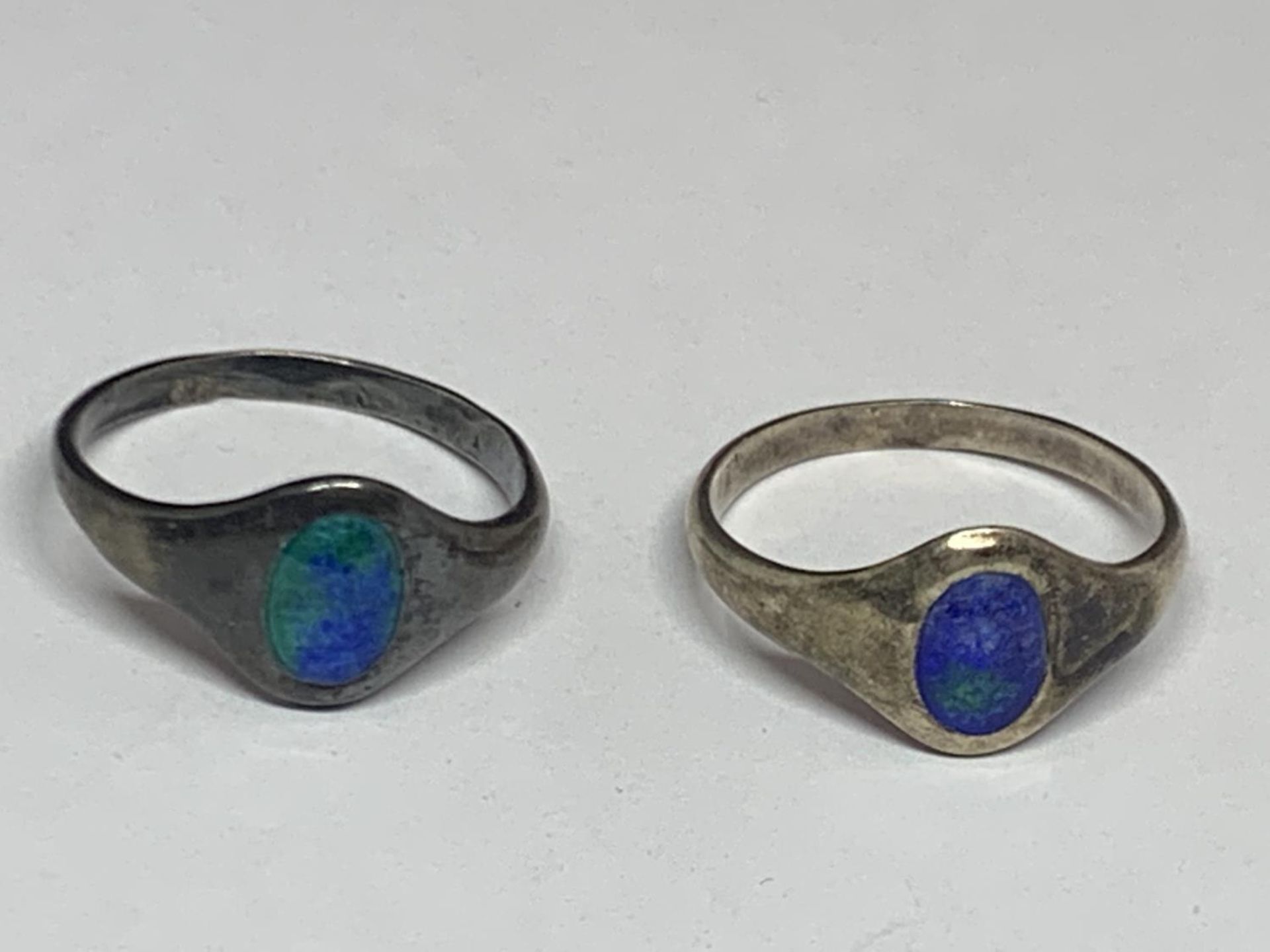 TWO ART NOUVEAU HALLMARKED SILVER AND BLUE ENAMEL SIGNET RINGS