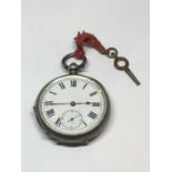 A .900 GRADE SILVER OPEN FACED POCKET WATCH WITH KEY