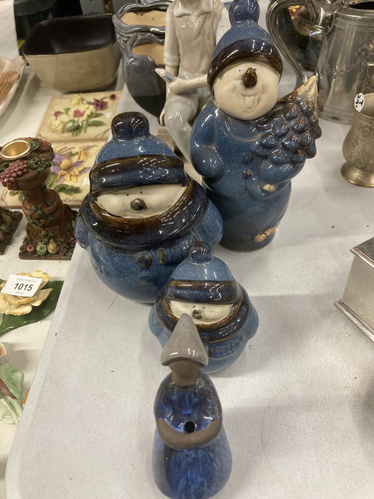 A QUANTITY OF CERAMICS TO INCLUDE A CASCADES FIGURE OF A FISHERMAN, SNOWMEN, PLANTERS, ETC.,