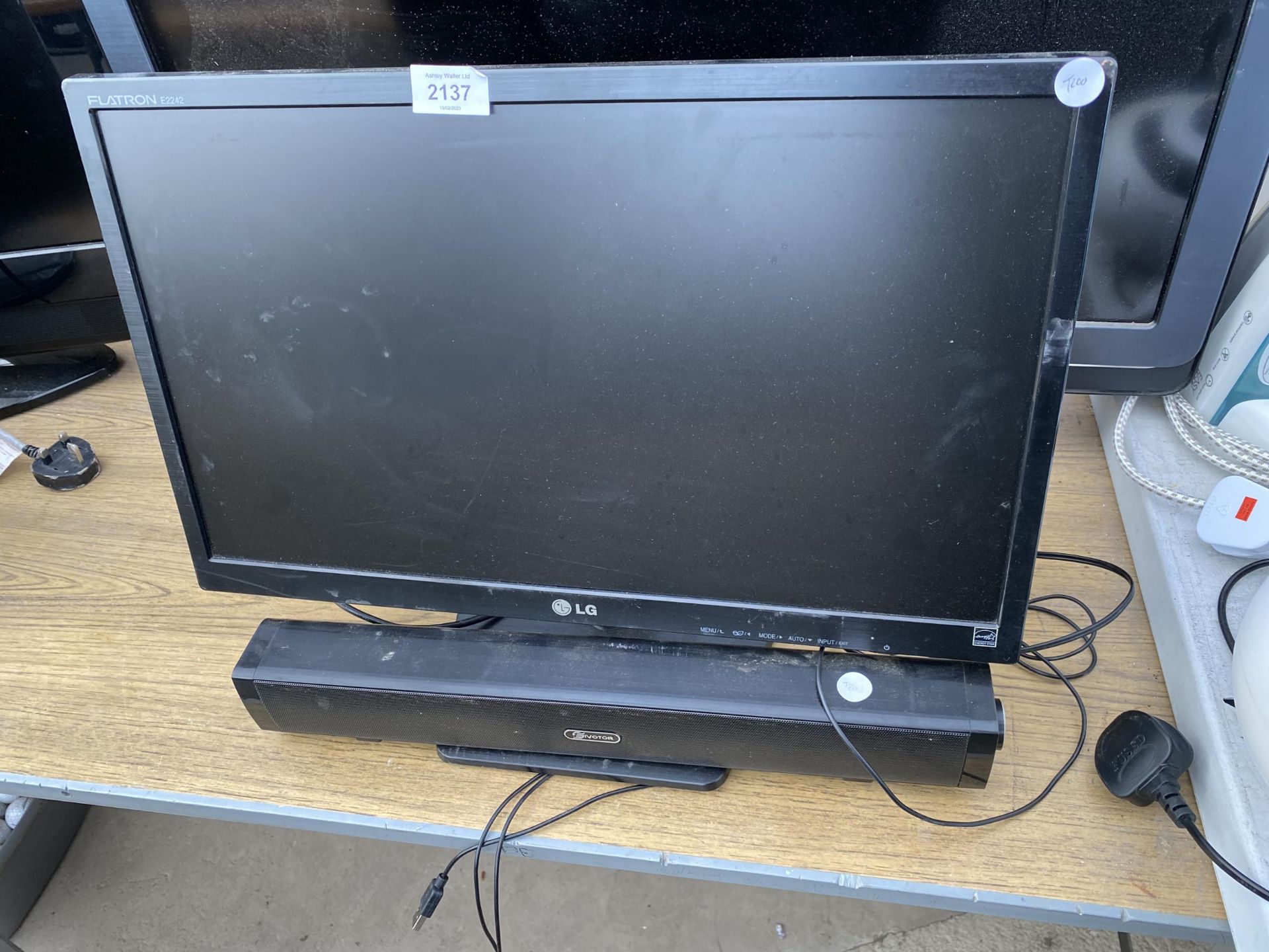 AN LG COMPUTER MONITOR AND A SPEAKER