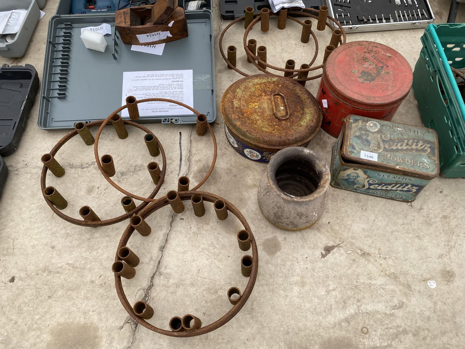 AN ASSORTMENT OF VINTAGE TINS AND SEVEN WROUGHT IRON GARDEN CANDLE HOLDERS