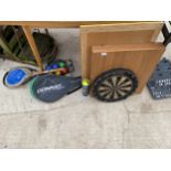AN ASSORTMENT OF ITEMS TO INCLUDE A NODOR DART BOARD AND A TENNIS RACKET ETC