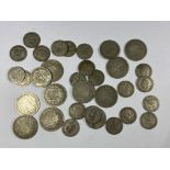 A BAG OF ASSORTED SILVER & HALF SILVER COINAGE