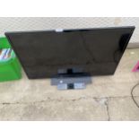 A TOSHIBA 32" TELEVISION WITH REMOTE CONTROL