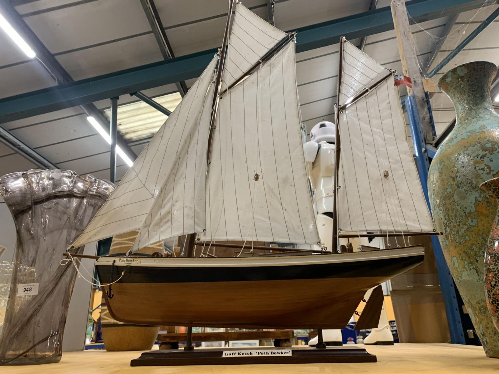 A WOODEN MODEL OF A SAILING BOAT CALLED 'POLLY BOWKER' LENGTH 68CM