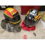 AN AGV MOTORBIKE HELMET AND A FURTHER FM MOTORBIKE HELMET