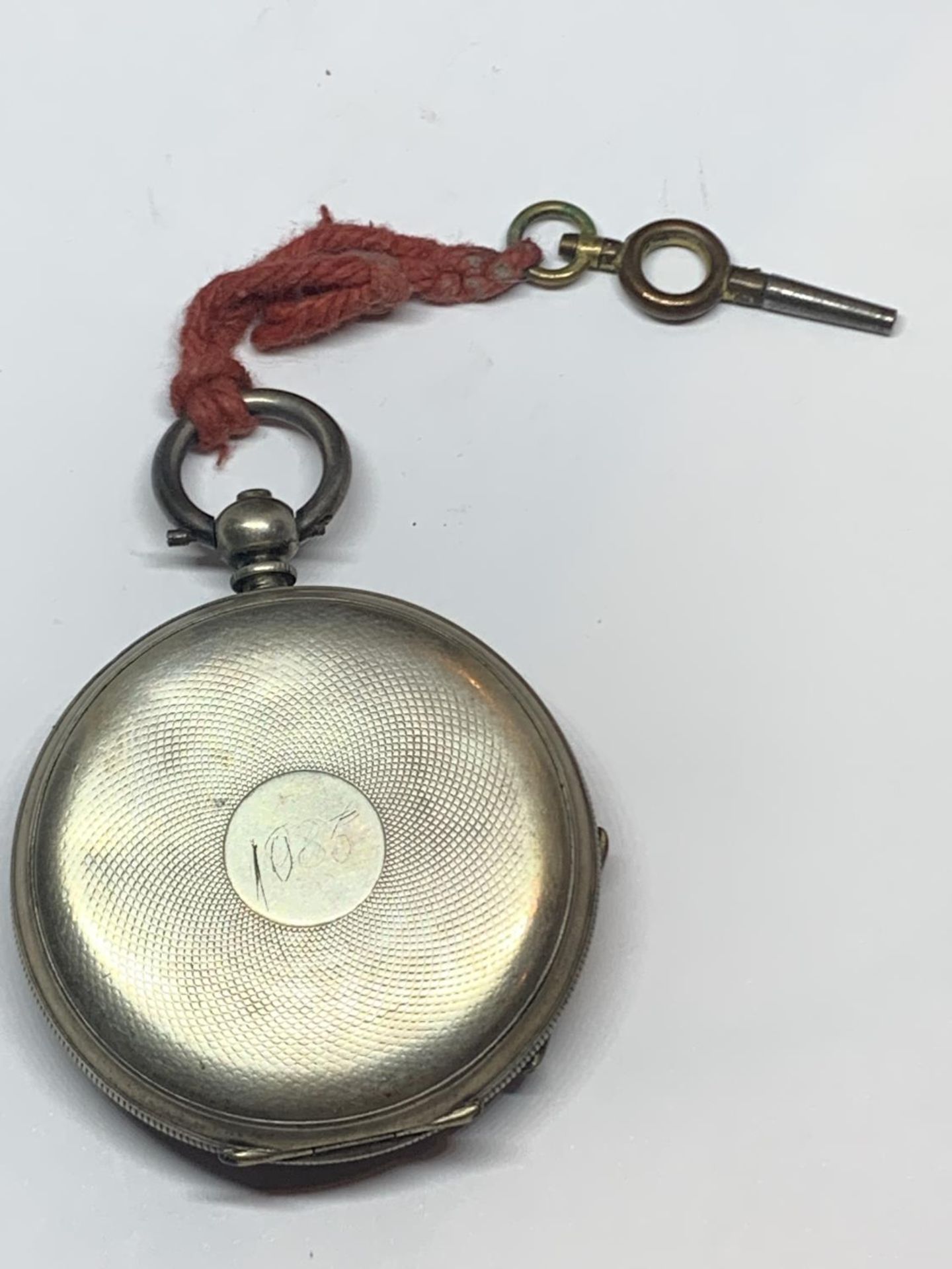 A .900 GRADE SILVER OPEN FACED POCKET WATCH WITH KEY - Image 2 of 4