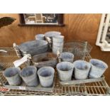 AN ASSORTMENT OF SMALL GALVANISED METAL GARDEN PLANTERS AND TROUGHS
