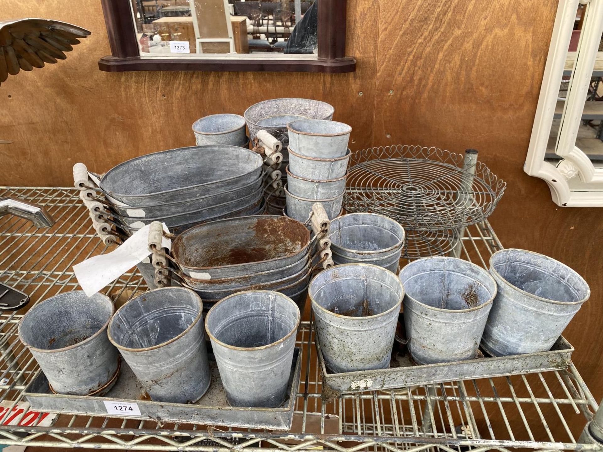 AN ASSORTMENT OF SMALL GALVANISED METAL GARDEN PLANTERS AND TROUGHS