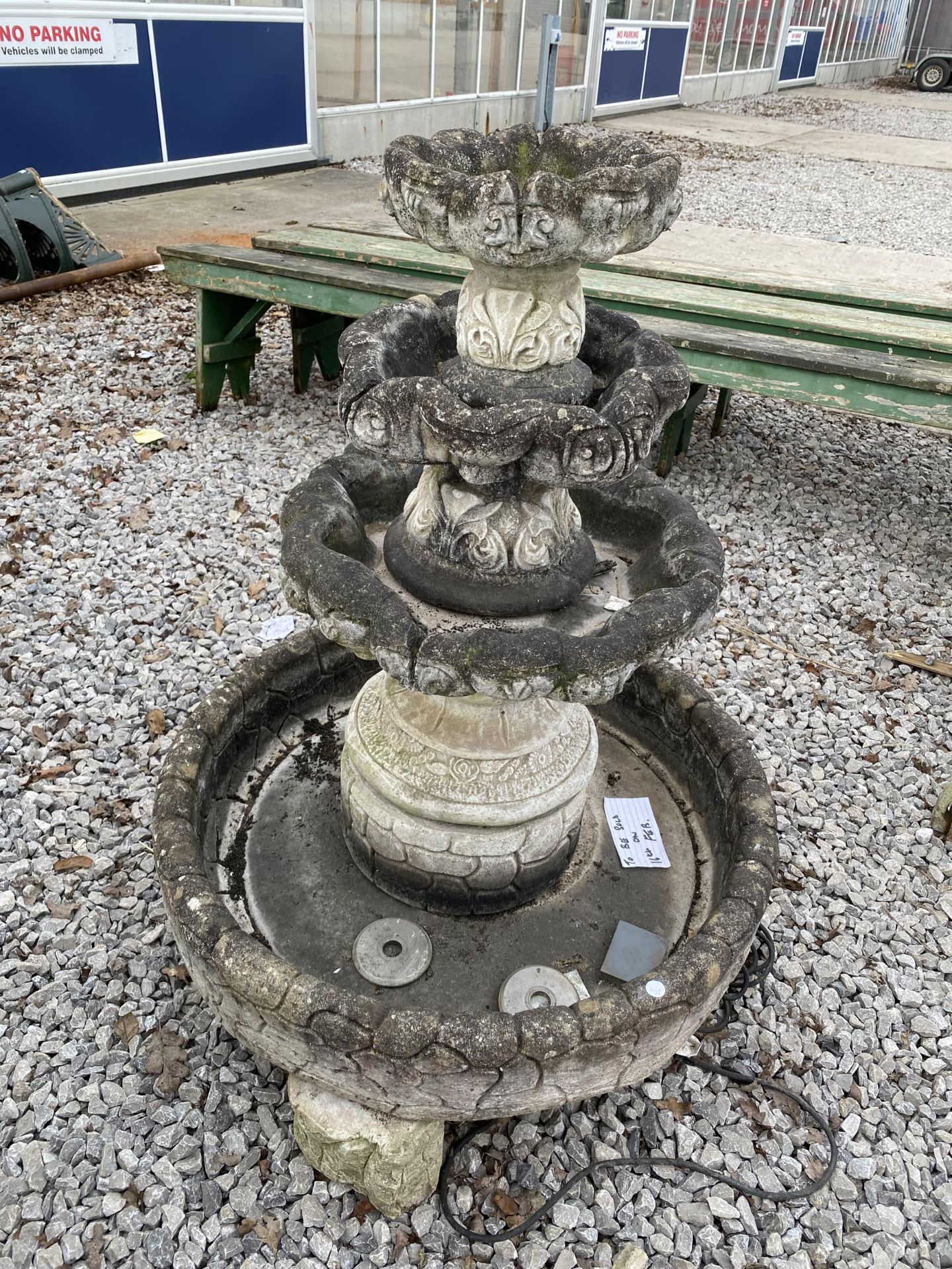 A THREE TIER RECONSTITUTED STONE GARDEN WATER FEATURE