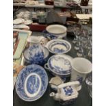 A QUANTITY OF BLUE AND WHITE POTTERY TO INCLUDE A CHAMBER POT, BOWLS A JUG, VASE, TEAPOT, ETC