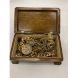 A QUANTITY OF COSTUME JEWELLERY TO INCLUDE NECKLACES, BRACELETS, ETC IN A VINTAGE WOODEN BOX