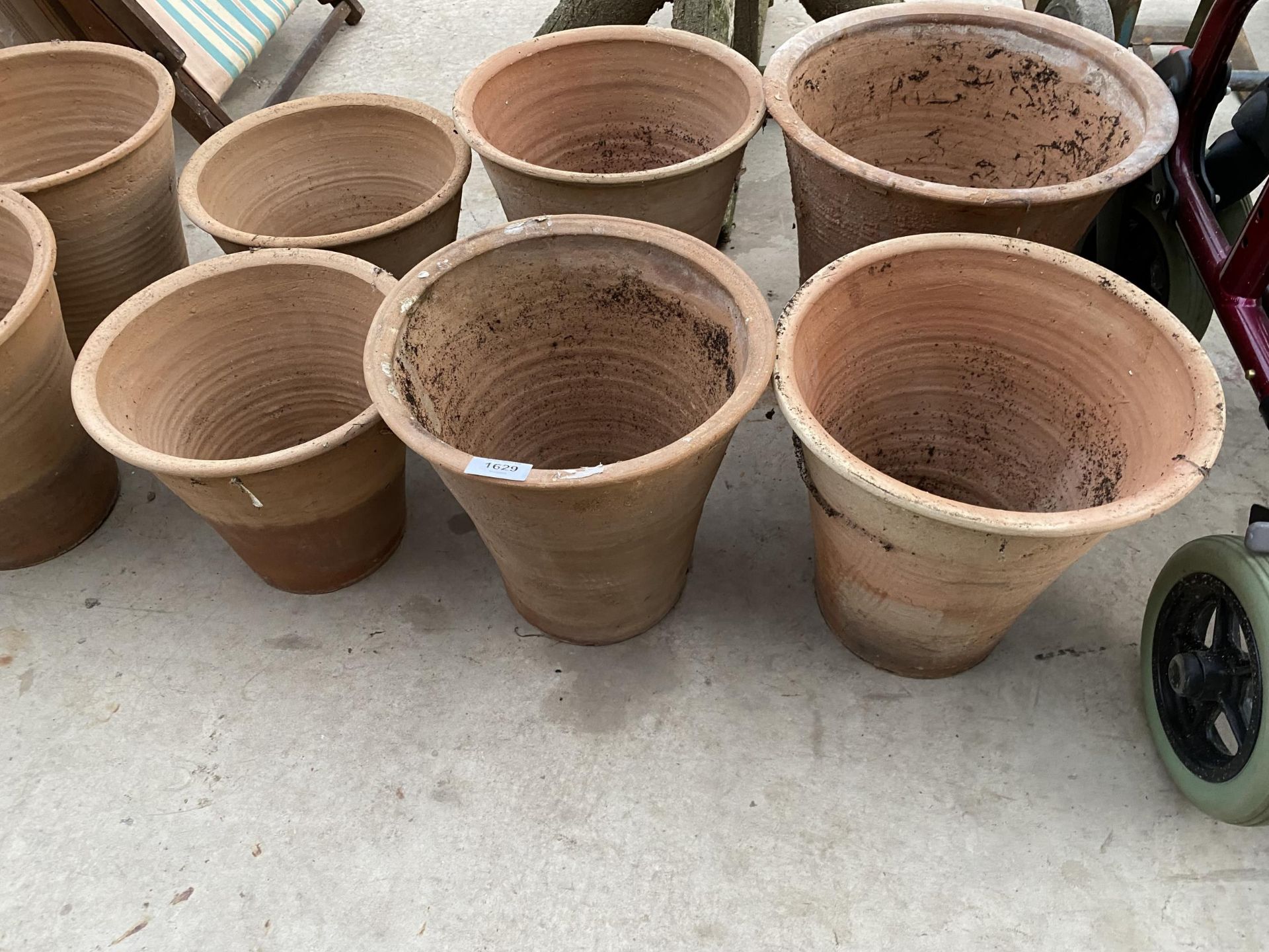 SIX LARGE TERACOTTA PLANT POTS