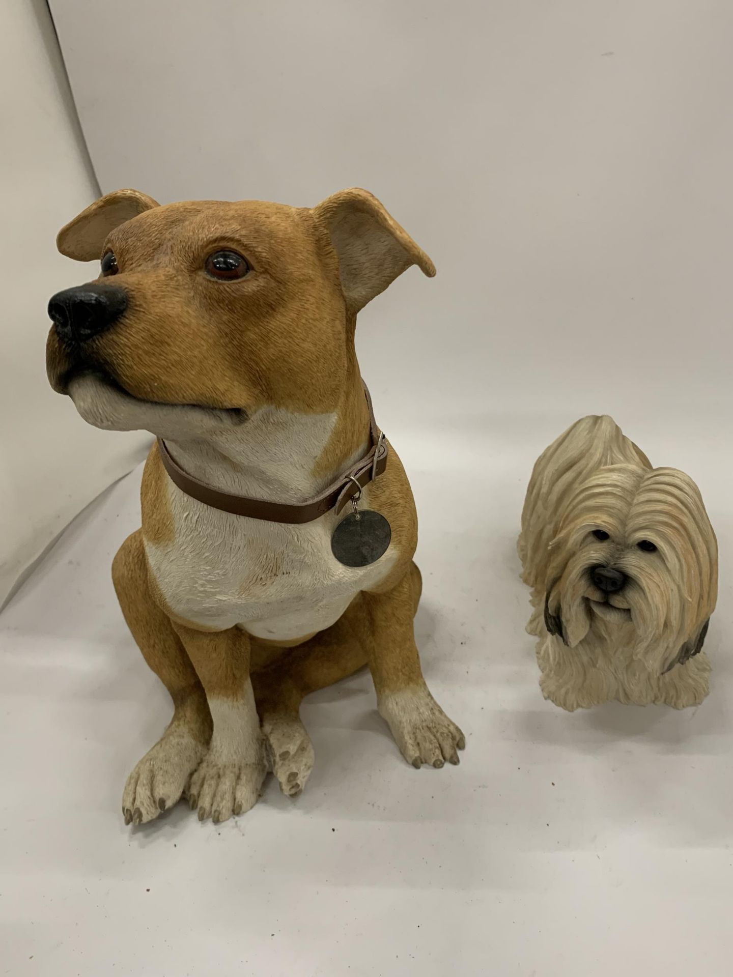 TWO LARGE DOG FIGURES BY LEONARDO, A STAFFORDSHIRE BULL TERRIER HEIGHT 34CM AND A LHASA APSO