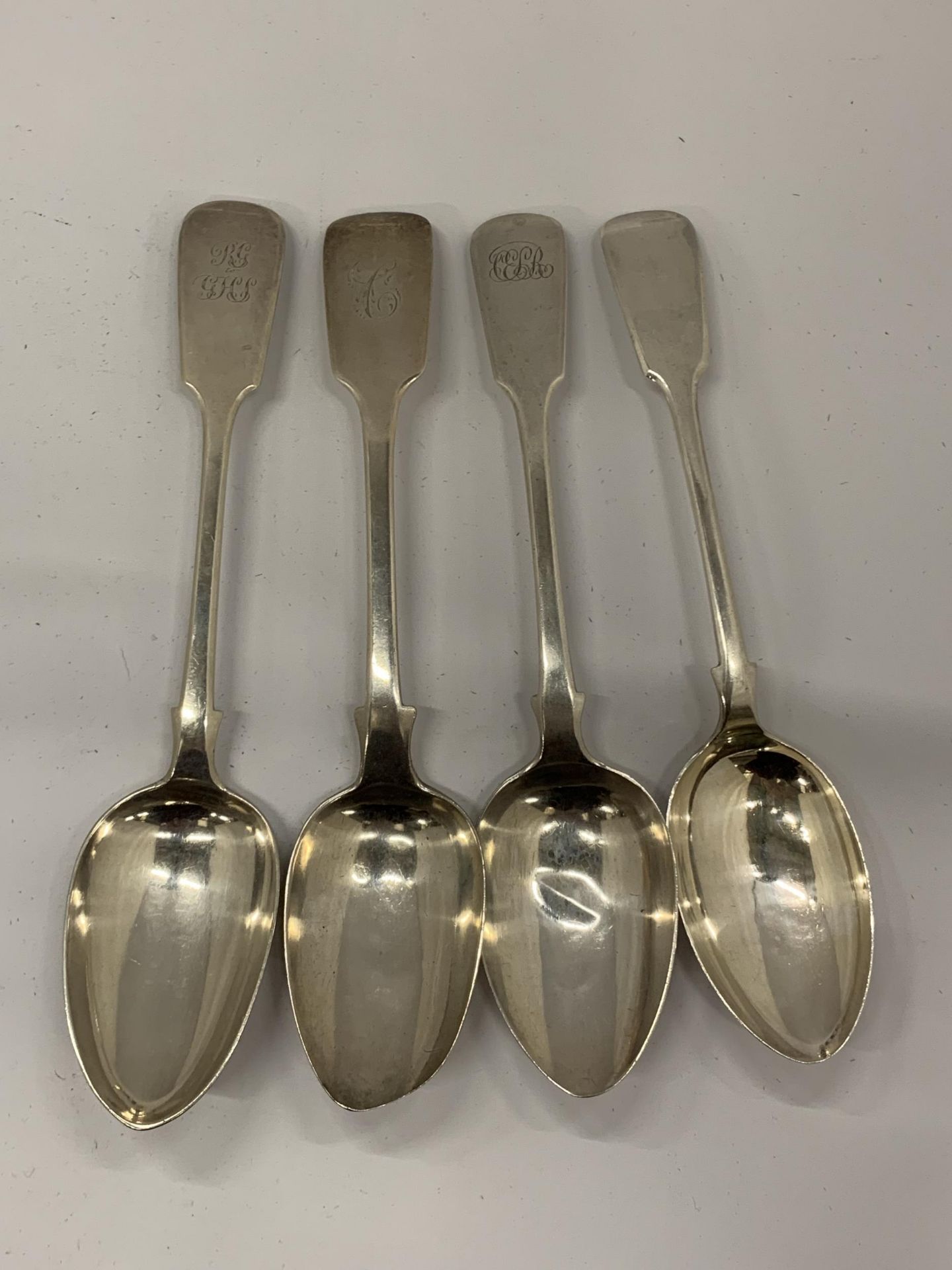 A GROUP OF FOUR HALLMARKED SILVER TABLE SPOONS TO INCLUDE TWO GEORGIAN EXAMPLES, TOTAL WEIGHT 310G