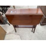 AN EDWARDIAN MAHOGANY SUTHERLAND TABLE