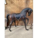 A LARGE VINTAGE LIBERTY STYLE LEATHER COVERED HORSE, HEIGHT 100CM, LENGTH 122CM