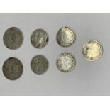 SEVEN SILVER COINS TO INCLUDE THREE PENCES AND SIX PENCES