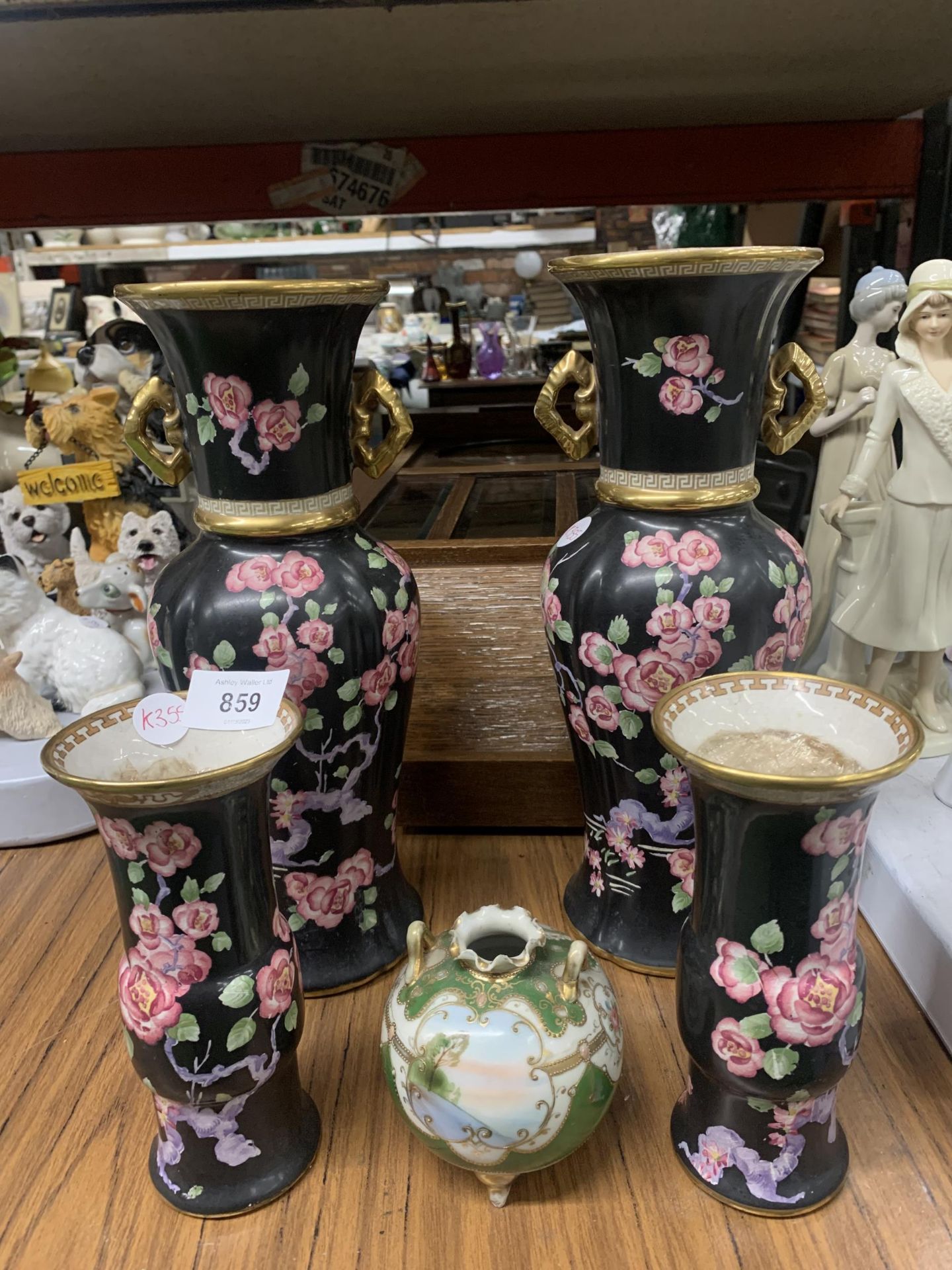 FIVE CERAMIC ITEMS TO INCLUDE TWO PAIRS OF MATCHING FLOWER DESIGN VASES AND A FURTHER POT