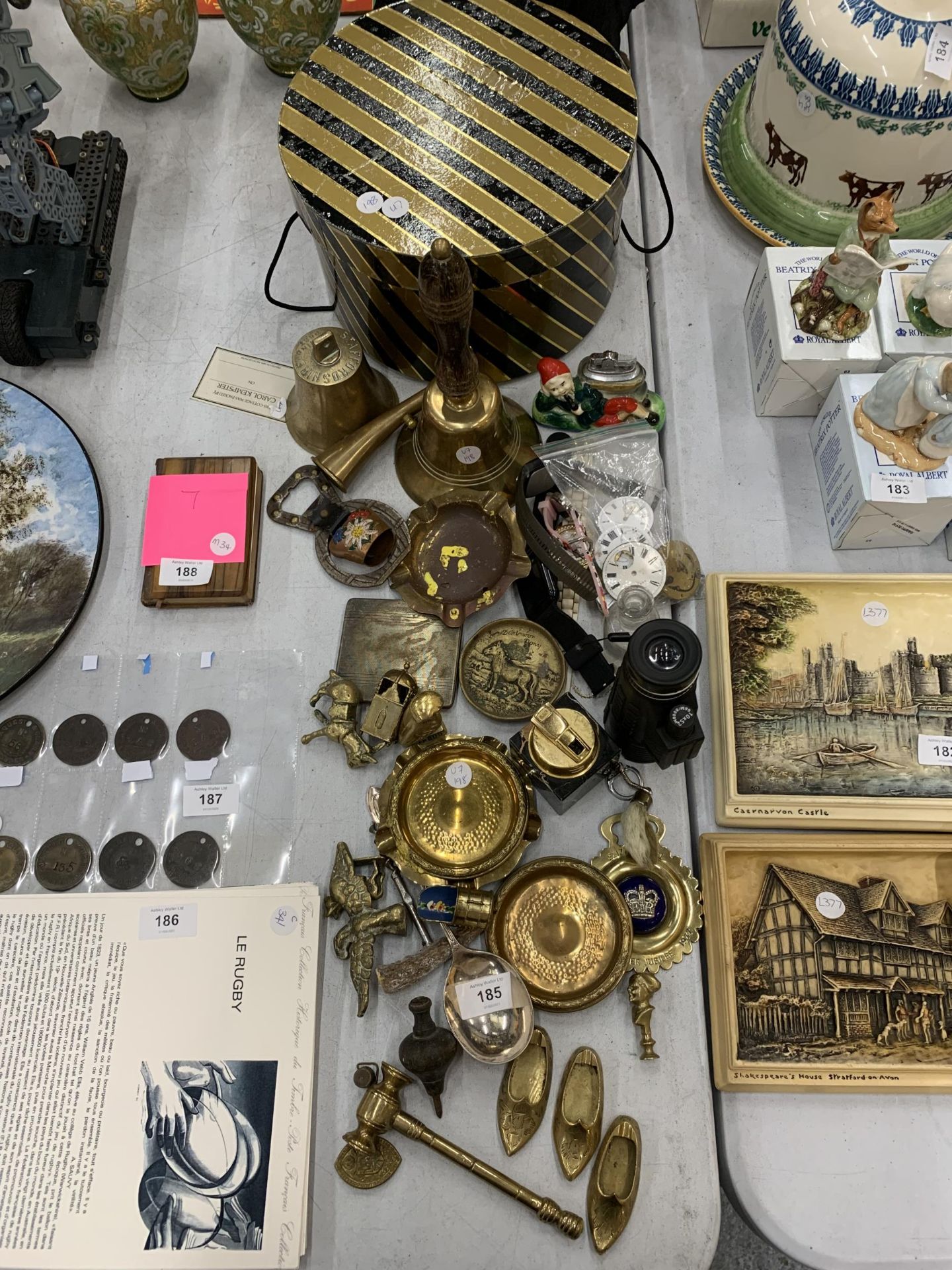 A LARGE COLLECTION OF BRASS ITEMS TO INCLUDE BELLS, FIGURES, ETC PLUS WATCH FACES, A CIGARETTE CASE,
