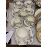A VINTAGE OLD FOLEY TEASET DECORATED WITH A FLORAL PATTERN TO INCLUDE CUPS, SAUCERS, SIDE PLATES,