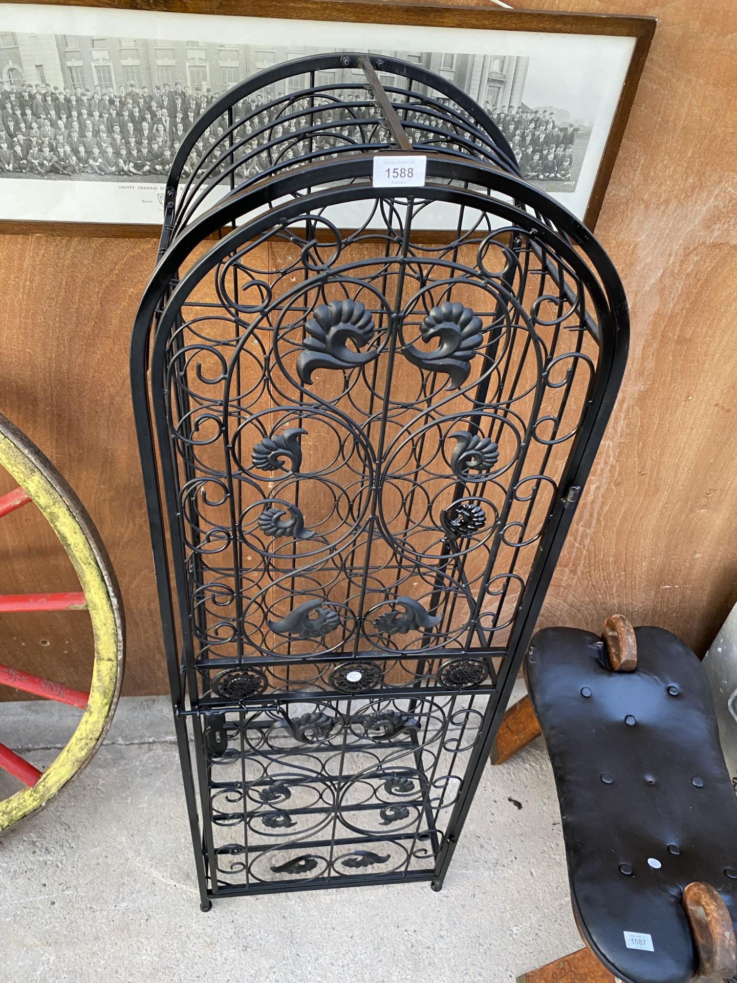 A METAL 45 SECTION WINE RACK WITH HINGED DOOR