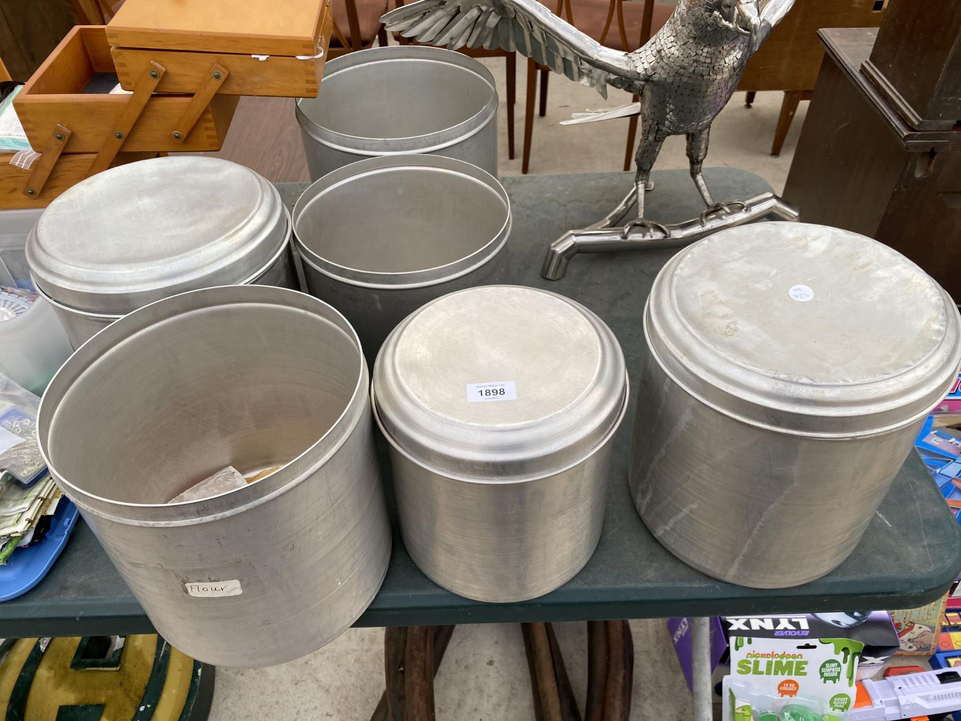 SIX STAINLESS STEEL STORAGE POTS TO INCLUDE THREE WITH LIDS