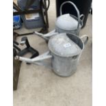 TWO VINTAGE GALVANISED WATERING CANS