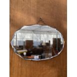 AN ART DECO UNFRAMED FOURTEEN SIDED BEVELED EDGE WALL MIRROR