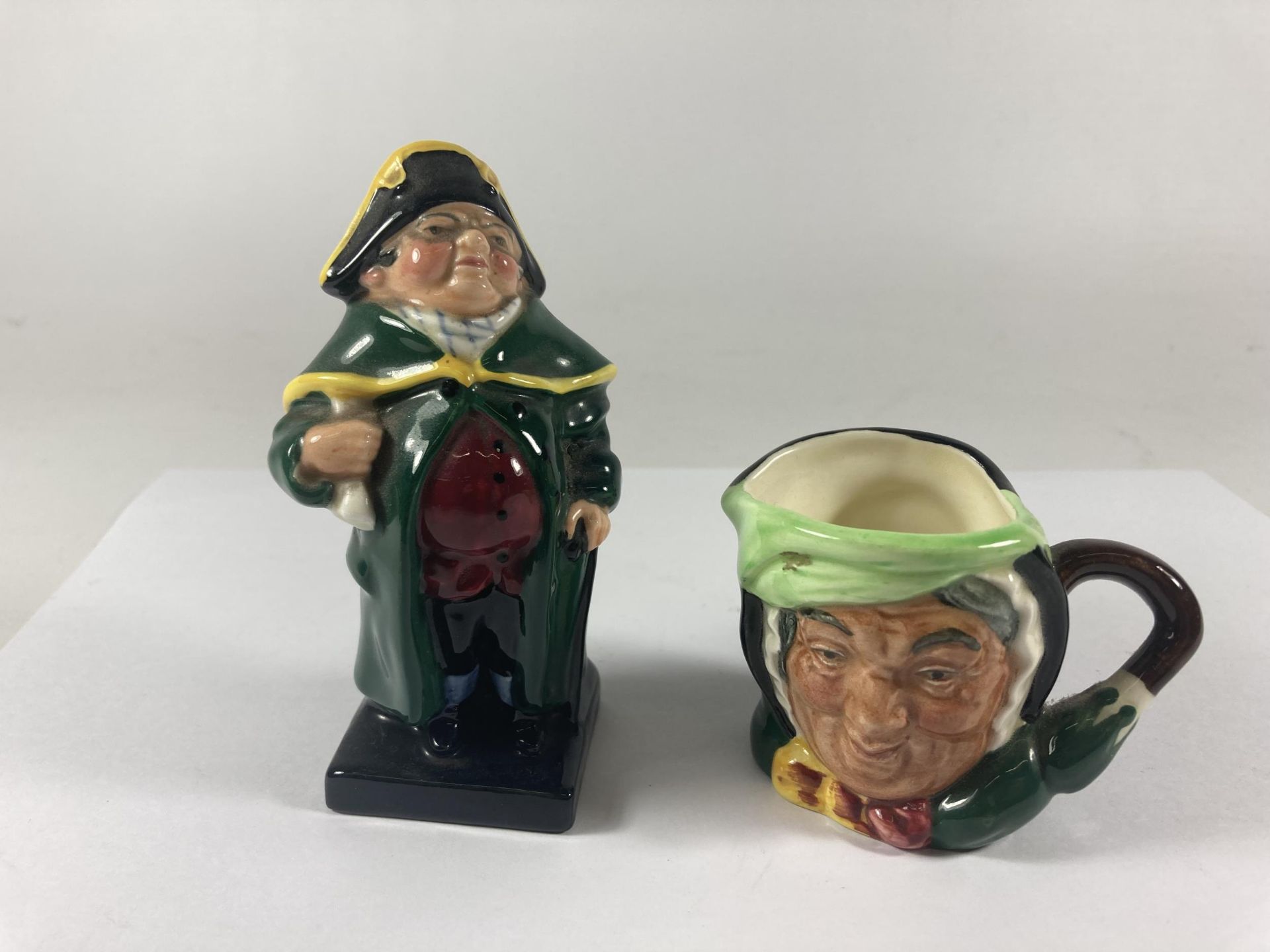 TWO ROYAL DOULTON ITEMS TO INCLUDE A BUMBLE FIGURE AND A SAIRY GAMP MINIATURE TOBY JUG