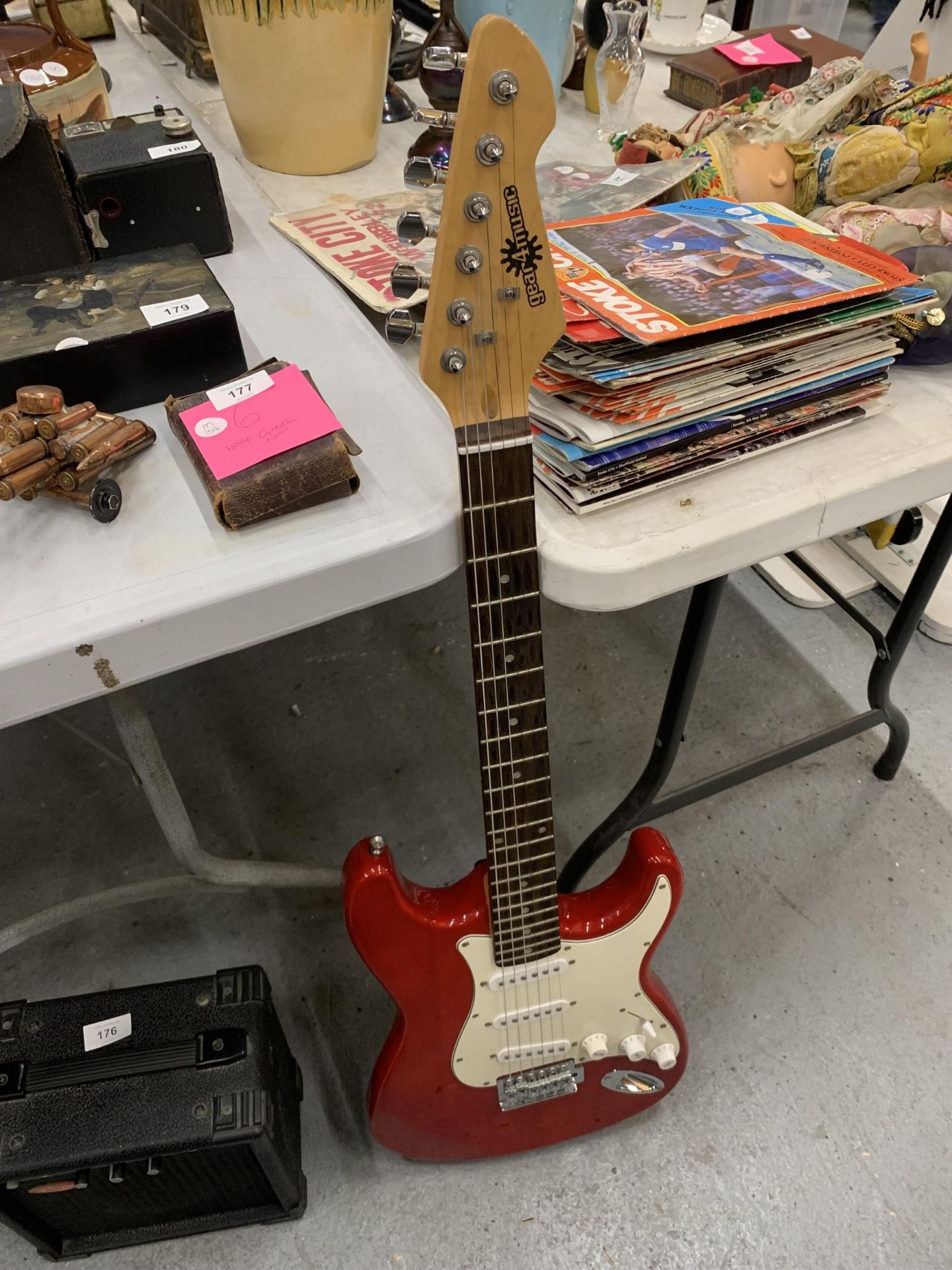 A 'GEAR4MUSIC' RED ELECTRIC GUITAR & A STAGG ELECTRIC AMPLIFIER