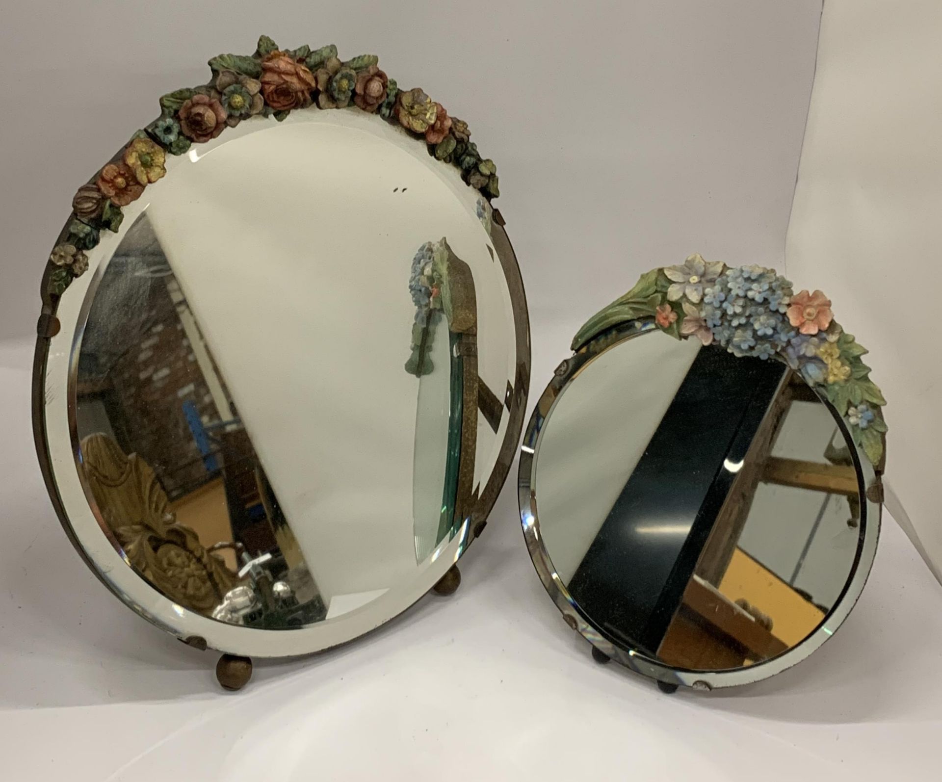 TWO FLORAL DESIGN BARBOLA CIRCULAR MIRROR, DIAMETER OF LARGEST 30CM