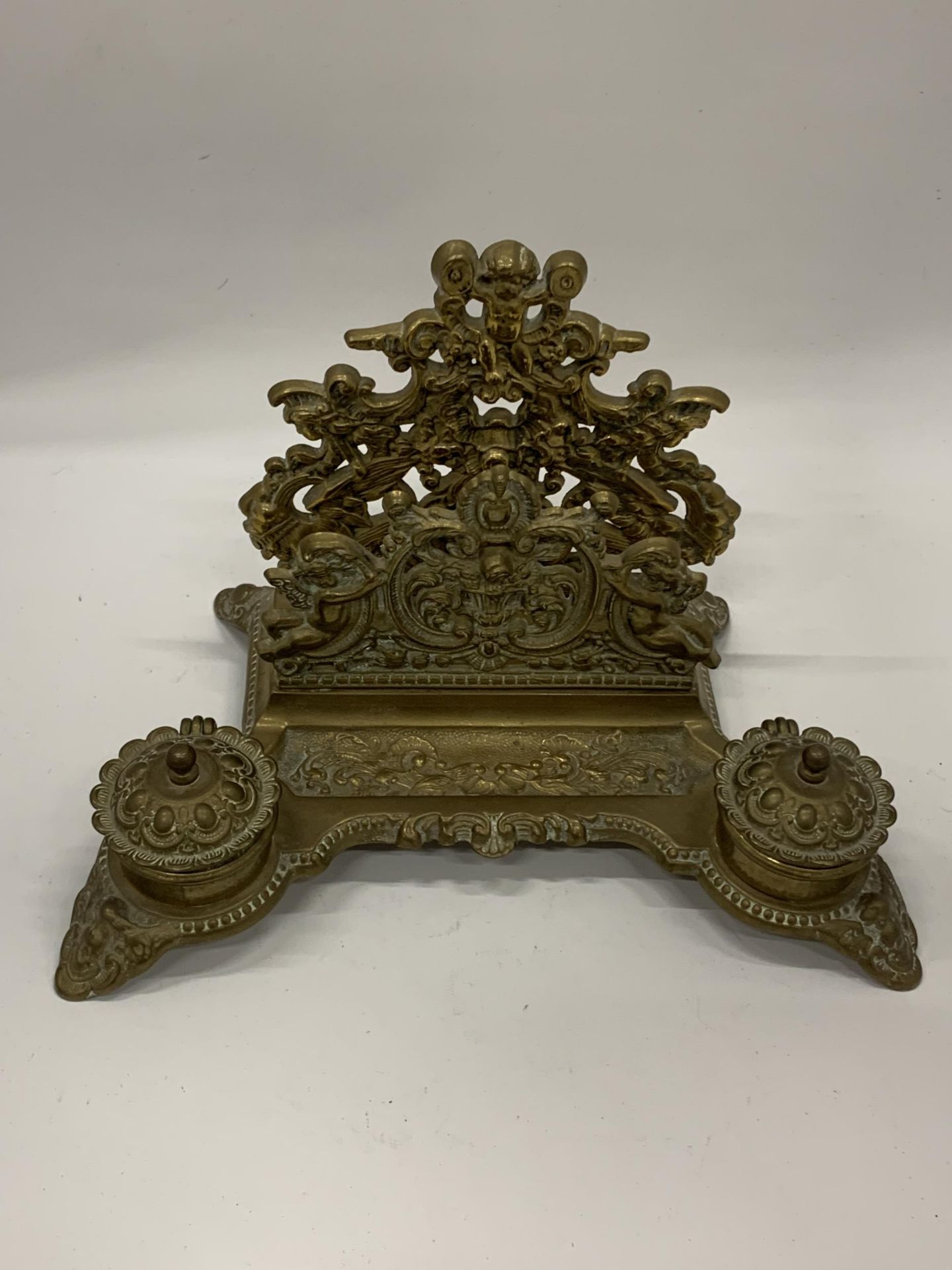 A DECORATIVE BRASS INKSTAND