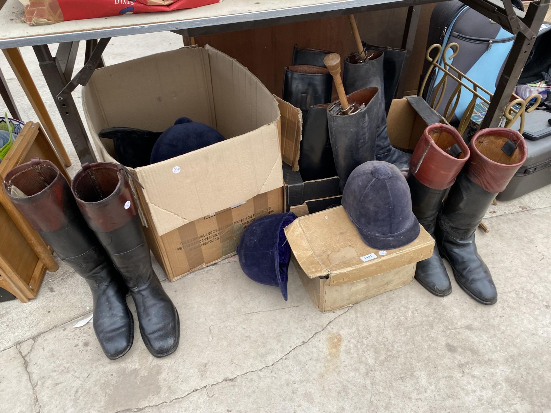 A LARGE ASSORTMENT OF VINTAGE HORSE RIDING BOOTS AND HATS