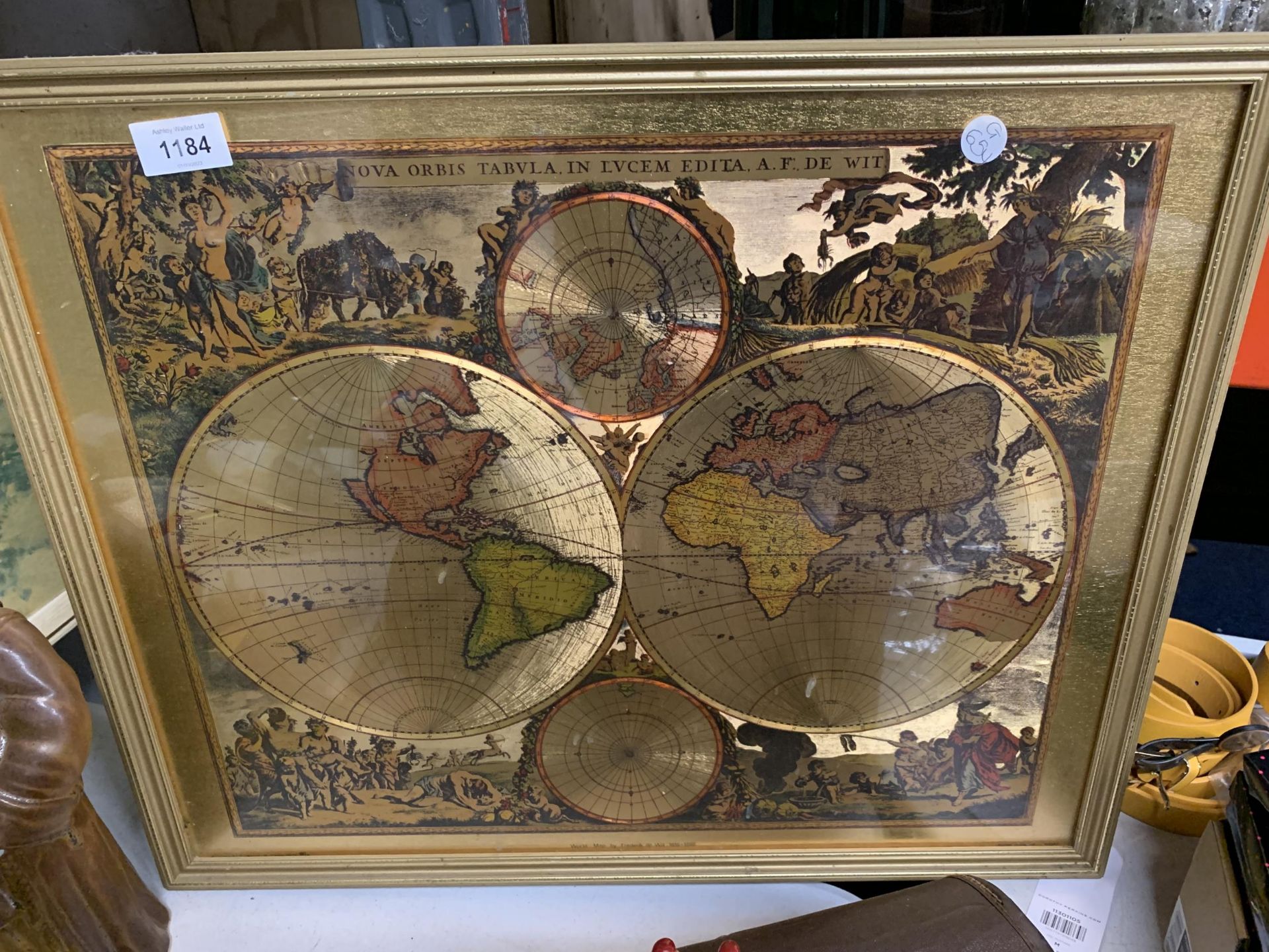 A FRAMED FOIL STYLE MAP WITH CHERUBIC SIDE PICTURES