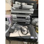 A LARGE ASSORTMENT ITEMS TO INCLUDE VHS PLAYERS AND DVD PLAYERS