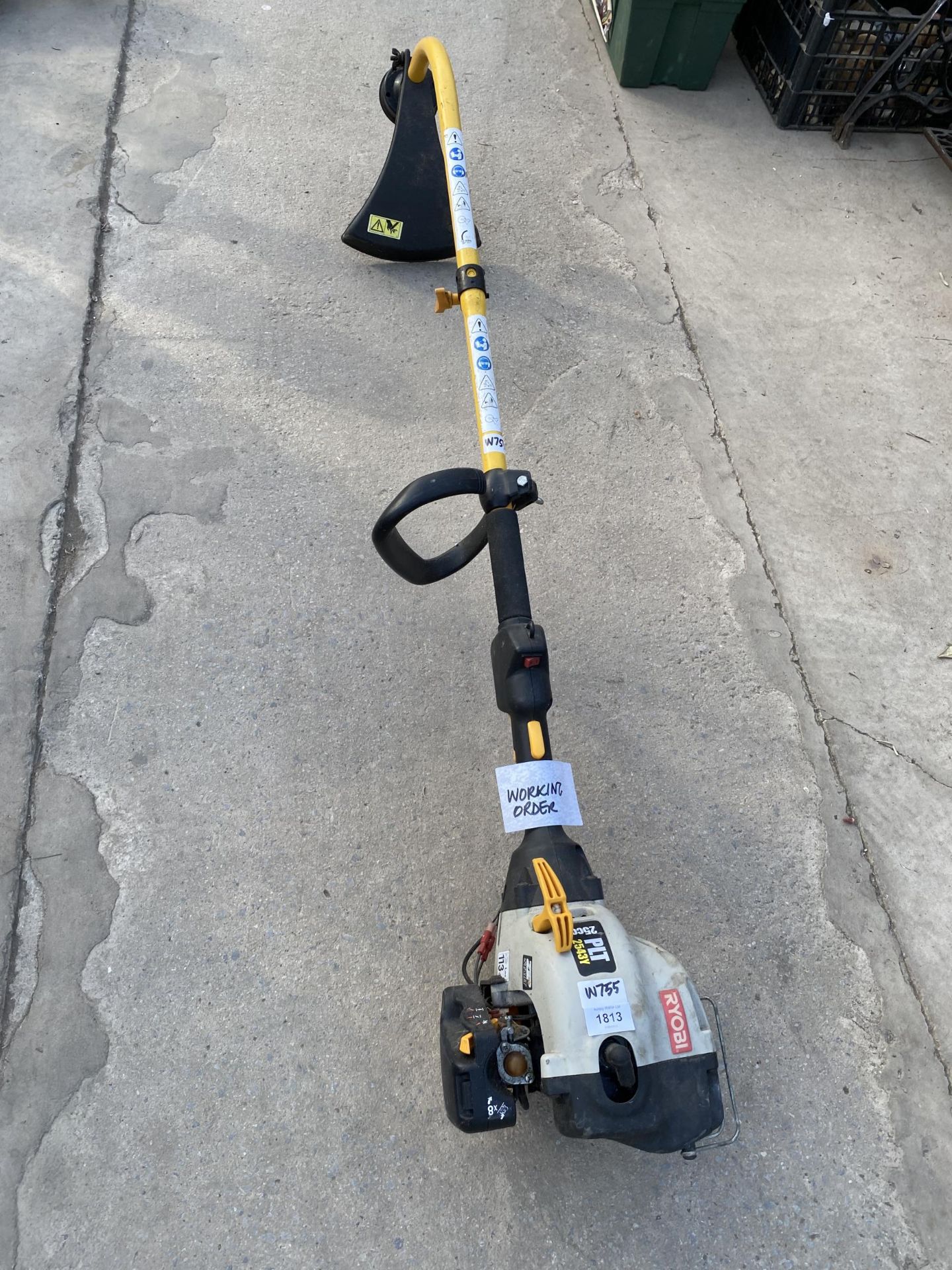 A RYOBI PETROL ENGINE GRASS STRIMMER