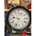 A VINTAGE STYLE 'TOWCESTER CLOCK WORKS CO' WALL CLOCK