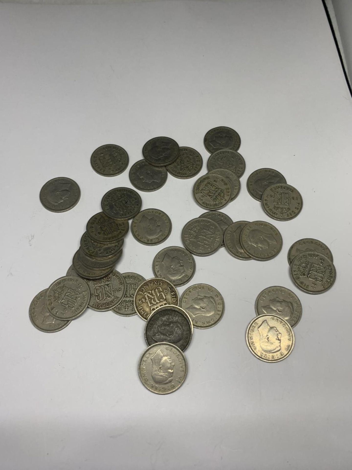 A QUANTITY OF SILVER SIXPENCES