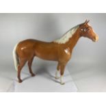A LARGE BESWICK PALAMINO HORSE